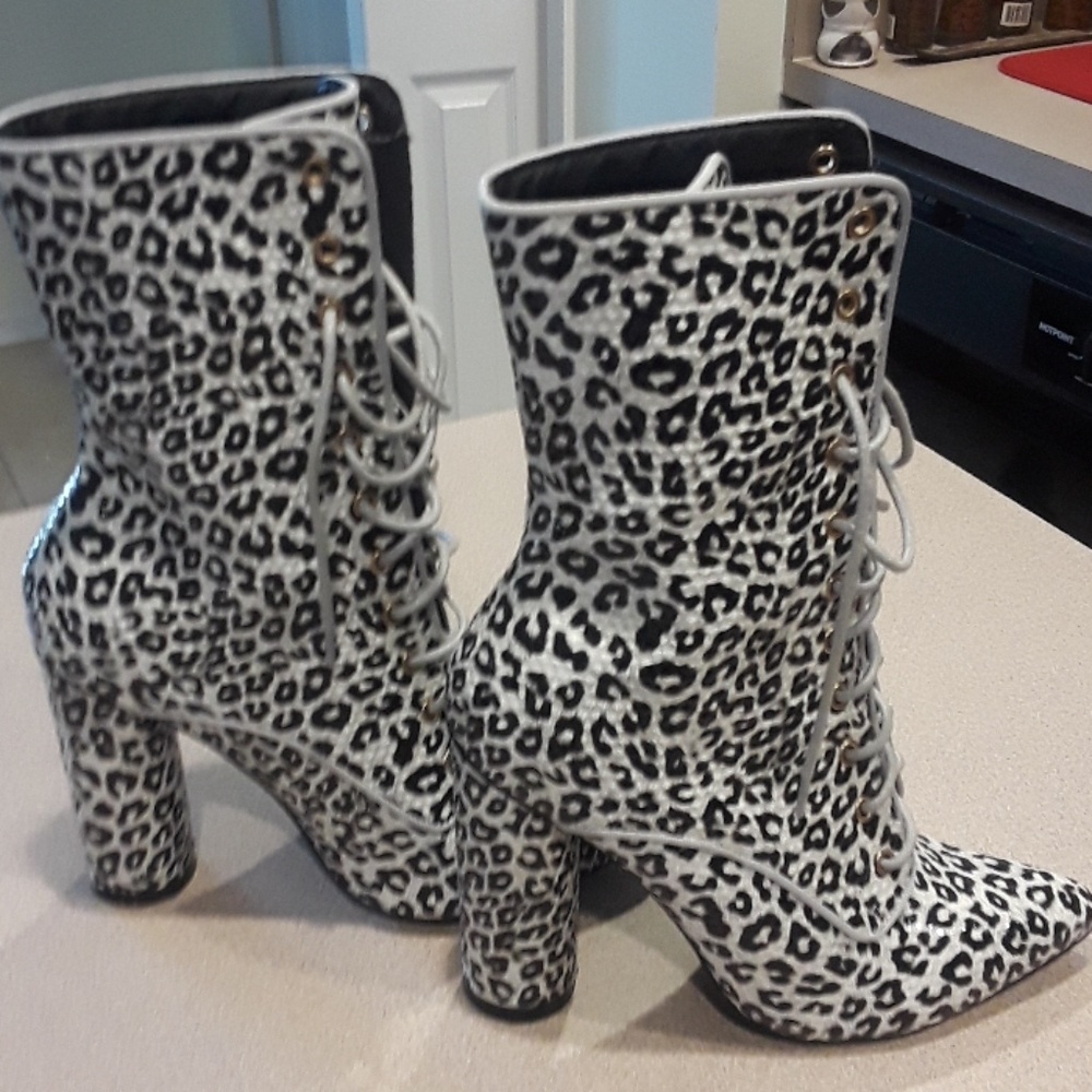 White and black patten leather leopard ankle boots